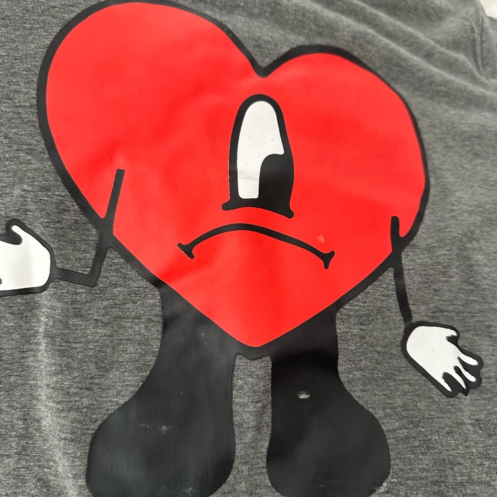 Bad Bunny T-shirt with logo on front.  Fun easy throw on t-shirt. Form fitting.